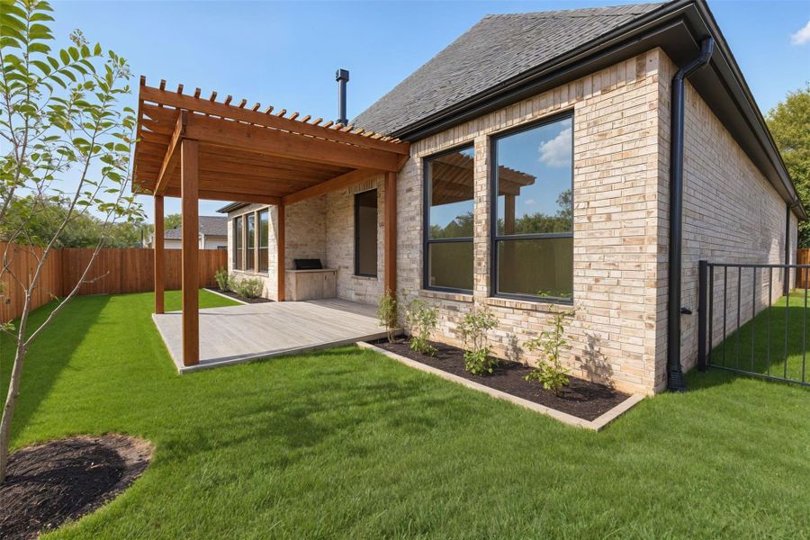 This backyard offers both privacy and charm. This backyard offers both privacy and charm.