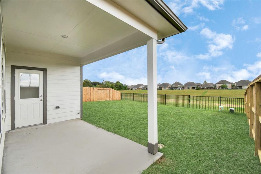 Come and see this spacious backyard with its beautiful covered patio. There is plenty of room for the kids to play and adults to relax. Perfect for your outdoor living space, patio furniture, bbq pit, and so much more. The possibilities are endless!