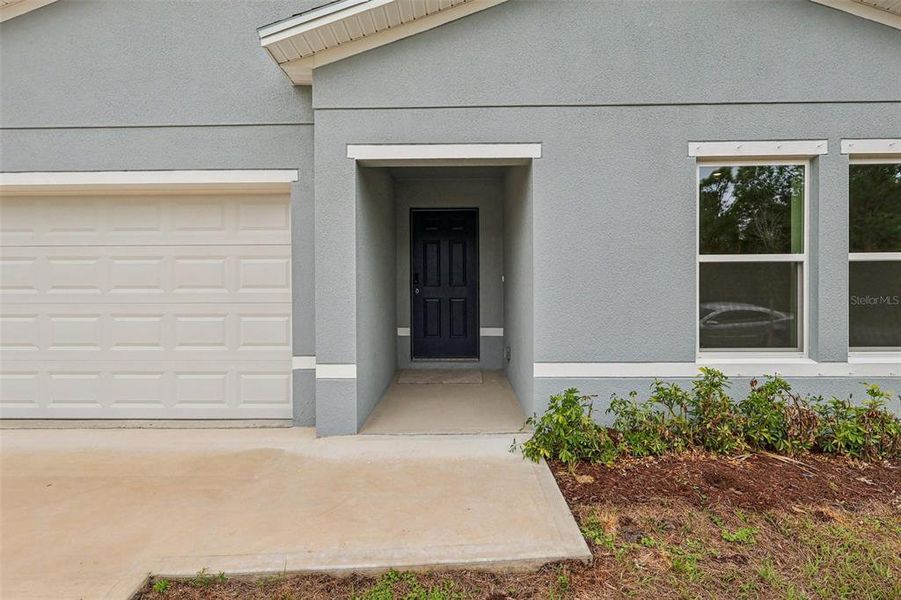 Exterior details and patio area of a home in Palm Bay Classic, Palm Bay (Image 17).