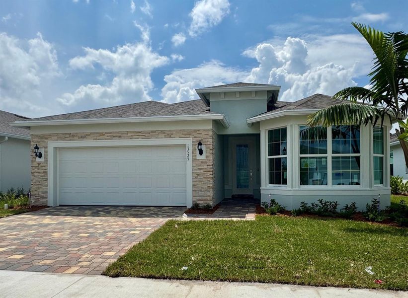 Front exterior of a new home in Del Webb Tradition, Port St. Lucie, FL, highlighting curb appeal (Image 12).