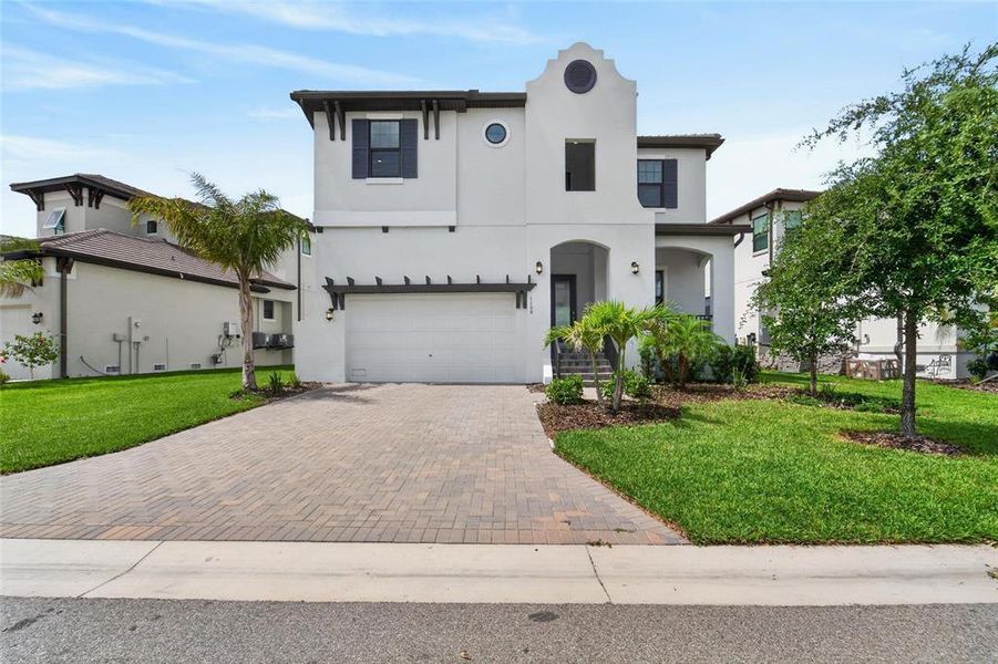 Front exterior of a new home in SouthShore Yacht Club, Ruskin, FL, highlighting curb appeal (Image 28).