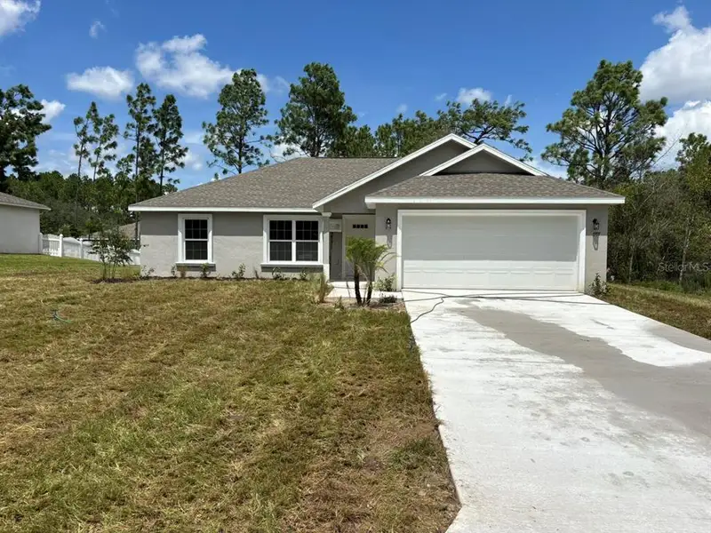 Front exterior of a new home in , Dunnellon, FL, highlighting curb appeal (Image 2). Front exterior of a new home in , Dunnellon, FL, highlighting curb appeal (Image 2).