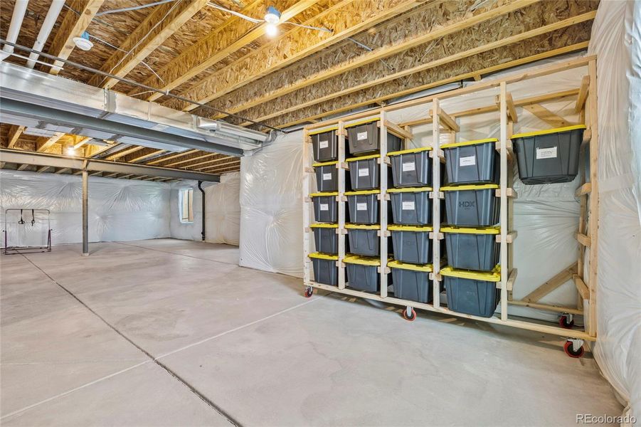 Unfinished basement w radon mitigation system