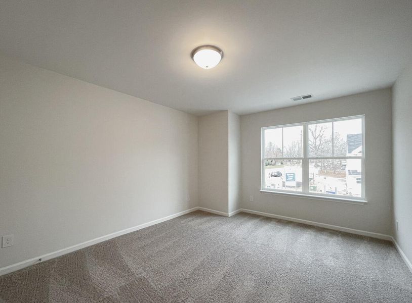 Spacious, unfurnished interior of a new home in East Main Townes, Spartanburg (Image 19).