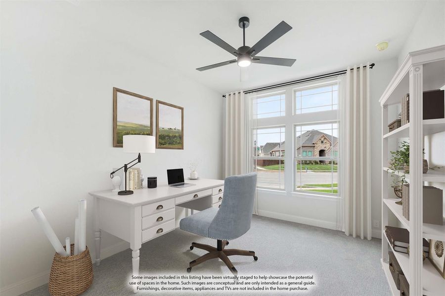 Home office with white desk, gray office chair, ceiling fan, and large window with neighborhood view Home office with white desk, gray office chair, ceiling fan, and large window with neighborhood view