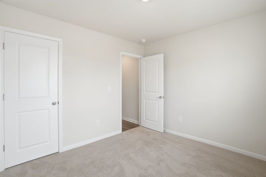 Representative unfurnished interior of a home built from the Juniper B by McGuinn Homes in Hunters Branch, Hopkins (Image 42).