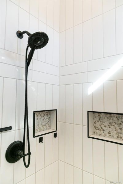 Floor to ceiling tile in Jack & Jill shower bathroom