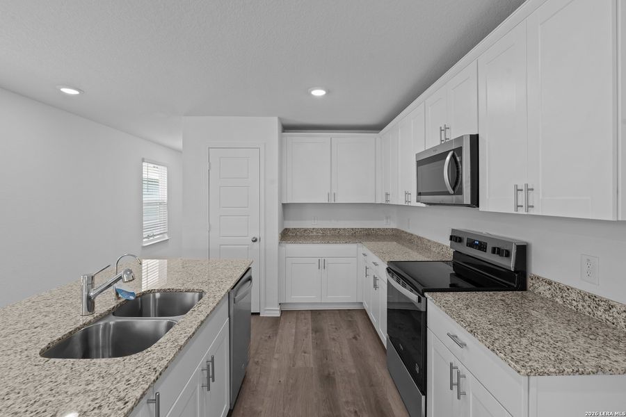 Furnished interior view inside a new home in Cinco Lakes, San Antonio (Image 4).