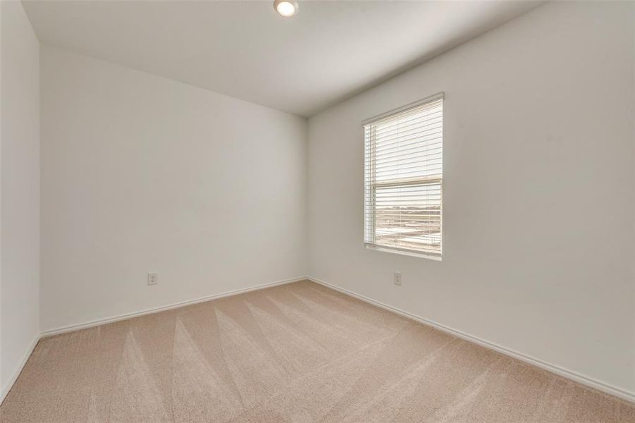 Unfurnished room featuring light colored carpet