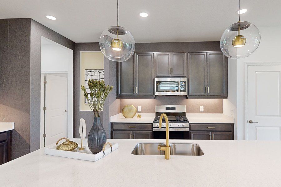 Representative furnished interior of a home built from the Tiller by Homes by Towne in Shellstone at Waterside, Sarasota (Image 8).