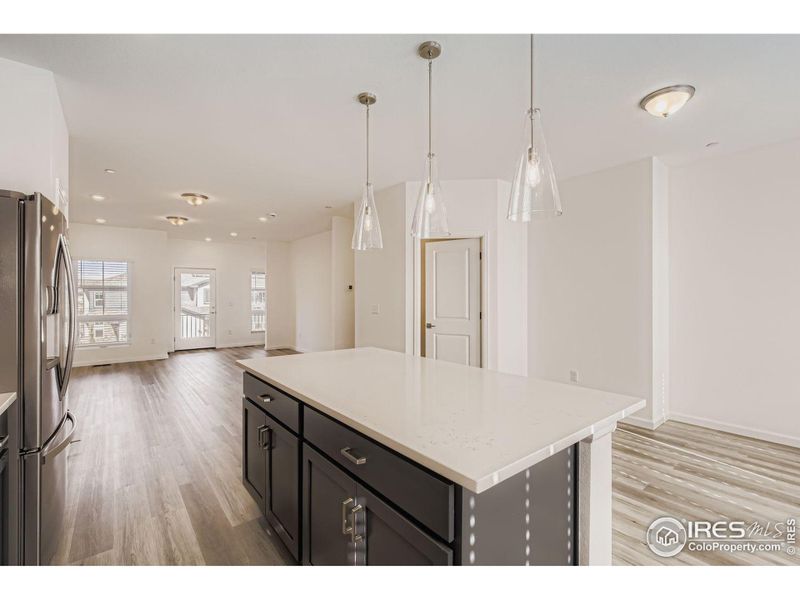 Open Concept Kitchen, Dining Room, and Great Room with the Balcony in the back (level 2)