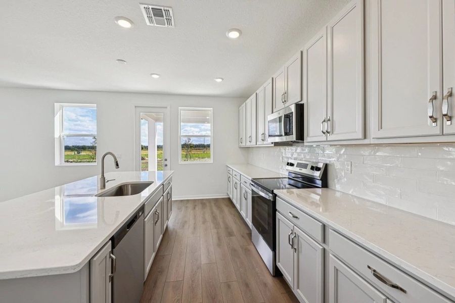 Furnished interior view inside a new home in Northlake at Ovation, Winter Garden (Image 9).