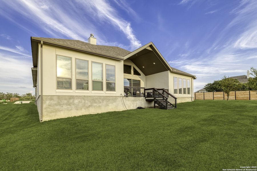 Front exterior of a new home in Megan's Landing 1/2 Acre, San Antonio, TX, highlighting curb appeal (Image 22). Front exterior of a new home in Megan's Landing 1/2 Acre, San Antonio, TX, highlighting curb appeal (Image 22).