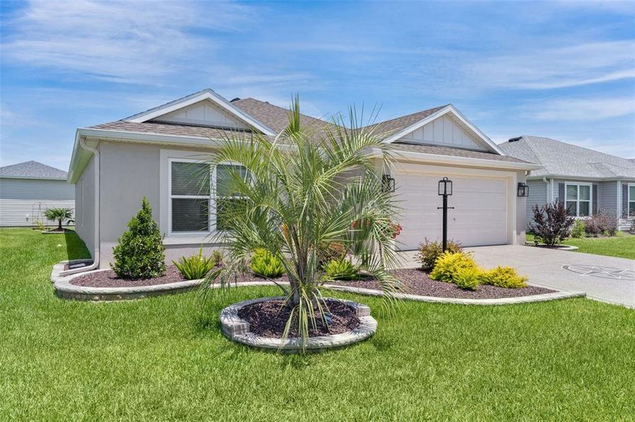 Front exterior of a new home in , The Villages, FL, highlighting curb appeal (Image 26).