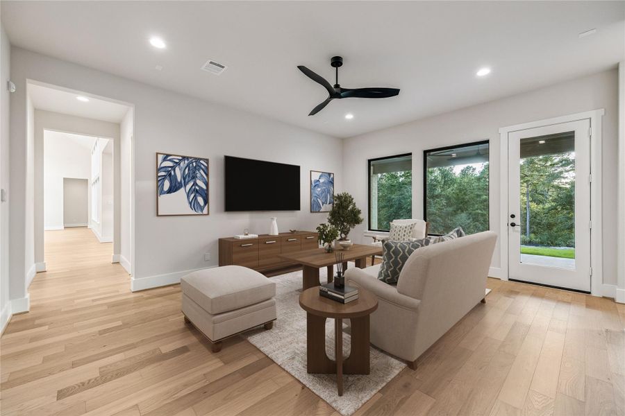 Game Room/Flex Space with direct access to Back Porch and yard. Virtually staged. Game Room/Flex Space with direct access to Back Porch and yard. Virtually staged.