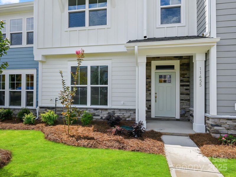 Front exterior of a new home in North Creek Village - Townhomes, Huntersville, NC, highlighting curb appeal (Image 2). Front exterior of a new home in North Creek Village - Townhomes, Huntersville, NC, highlighting curb appeal (Image 2).