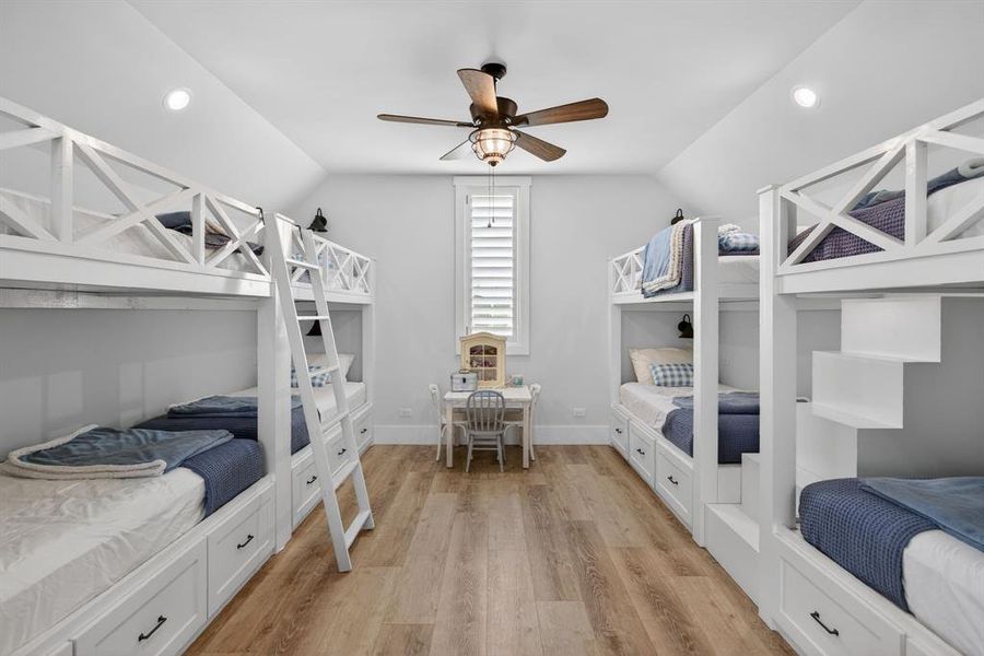 The only area of the home that is upstairs is this fantastic bonus room complete with 8, built-in bunks, a full bath, game area, and workout space.