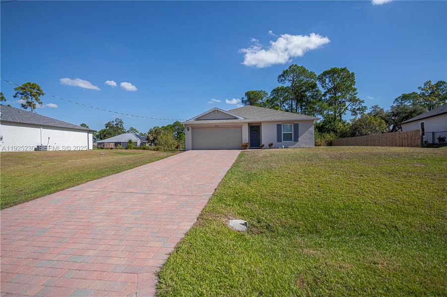 Front exterior of a new home in , Labelle, FL, highlighting curb appeal (Image 23).