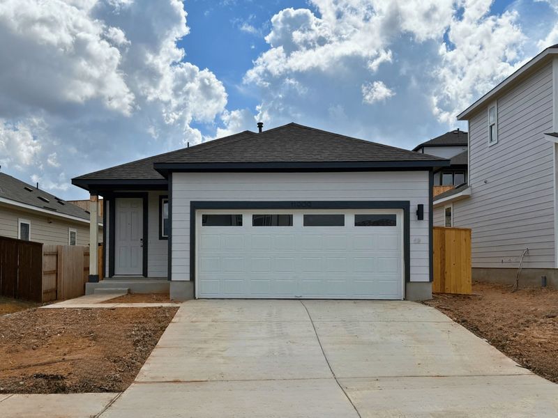 Front exterior of a new home in Cloverleaf, Austin, TX, highlighting curb appeal (Image 1). Front exterior of a new home in Cloverleaf, Austin, TX, highlighting curb appeal (Image 1).