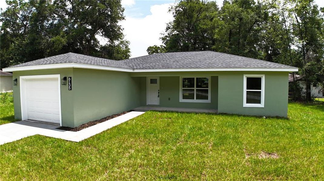 Front exterior of a new home in , Ocala, FL, highlighting curb appeal (Image 1). Front exterior of a new home in , Ocala, FL, highlighting curb appeal (Image 1).