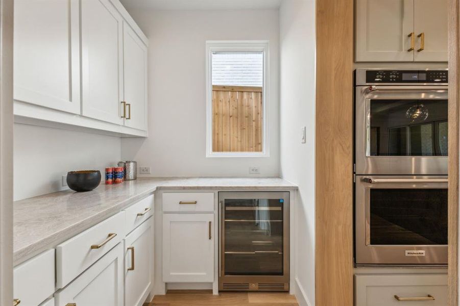 Butlers Pantry with wine fridge. Large Walk-in Pantry not pictured.