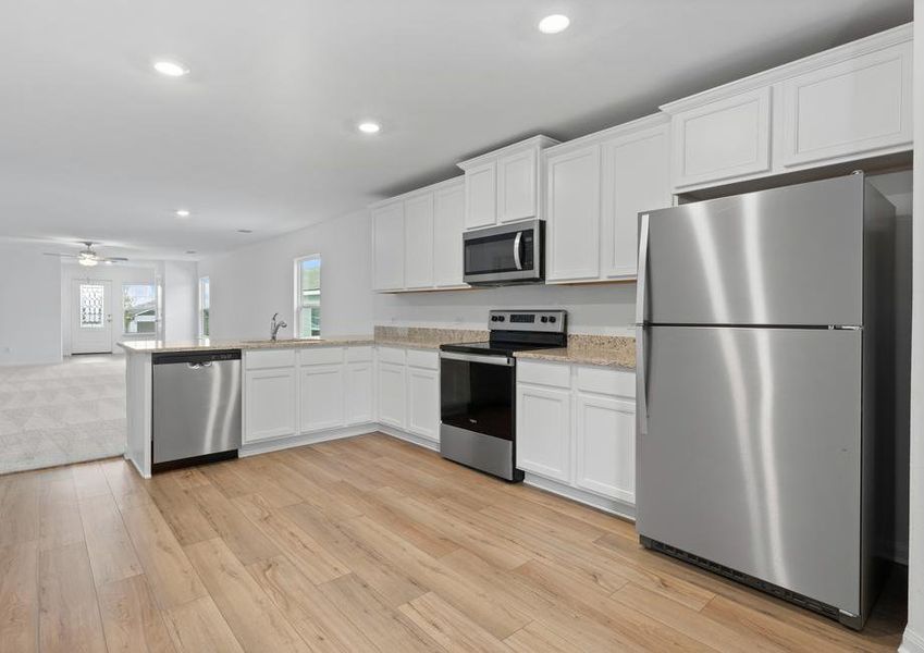 The kitchen features stainless steel appliances