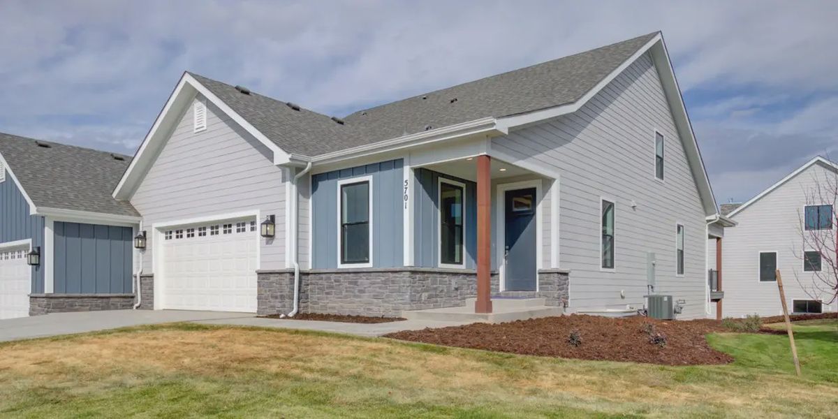 Representative exterior photo of a completed home built from the Fort Latham by Benchmark Custom Homes in Cottages at Kelly Farm, Greeley, CO (Image 1).