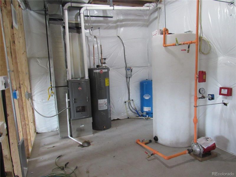 Utility room with washer dryer hook ups