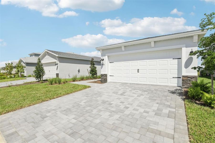 Exterior details and patio area of a home in Crescent Lakes - Premier Series, Punta Gorda (Image 3).