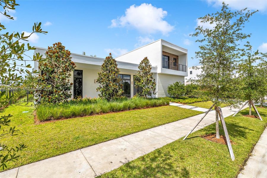Front exterior of a new home in , Weston, FL, highlighting curb appeal (Image 25).