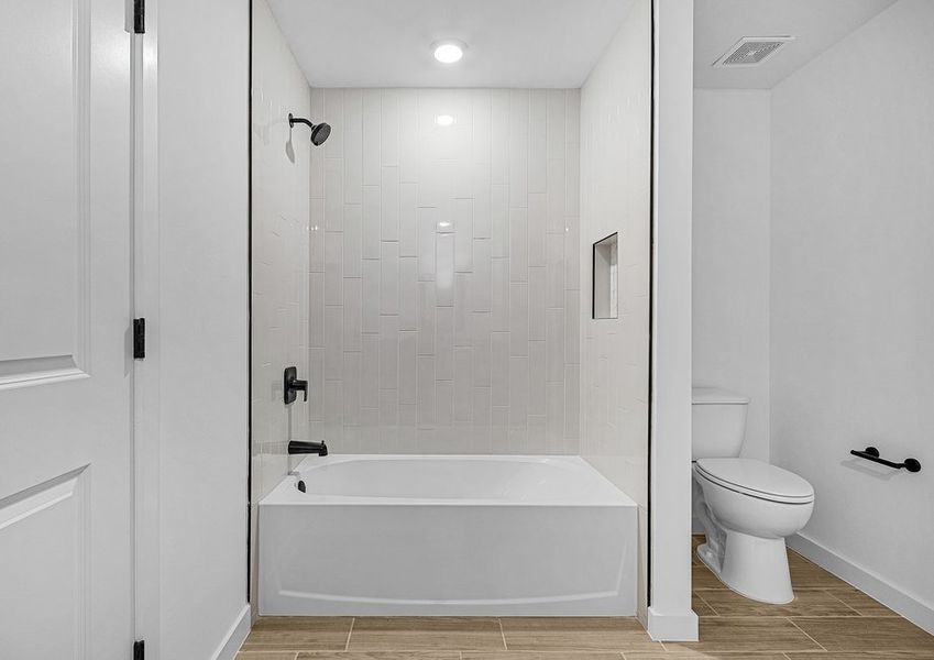 The master bathroom includes a dual shower and bathtub The master bathroom includes a dual shower and bathtub