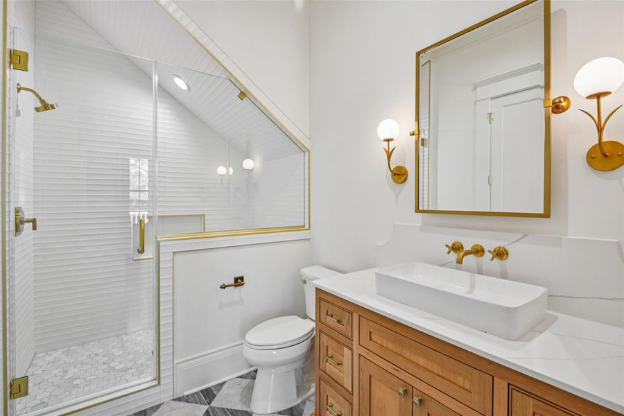 The powder bath is super sexy, with slate and white marble checkered flooring and a white oak built in, a vessel sink under wall mount plumbing fixtures and the most darling sconce lighting flanking the mirror. As always. the Modern Bungalow offers a full, yet attractive, shower in the downstairs bath. The powder bath is super sexy, with slate and white marble checkered flooring and a white oak built in, a vessel sink under wall mount plumbing fixtures and the most darling sconce lighting flanking the mirror. As always. the Modern Bungalow offers a full, yet attractive, shower in the downstairs bath.