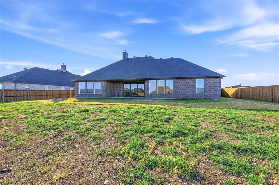 Exterior details and patio area of a home in Coyote Crossing, Godley (Image 27).