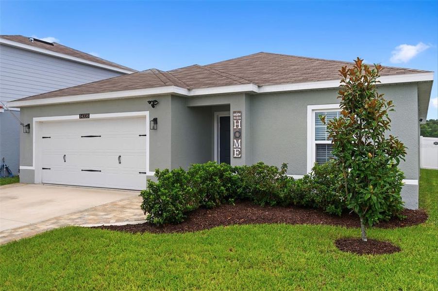 Front exterior of a new home in , Brooksville, FL, highlighting curb appeal (Image 22).