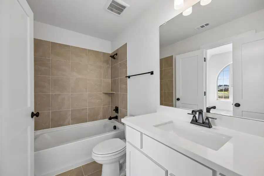 Furnished interior view inside a new home in Dominion of Pleasant Valley, Wylie (Image 11).