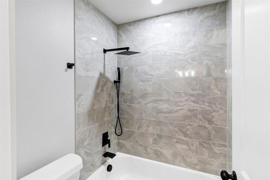 Full bath with washtub / shower combination and toilet