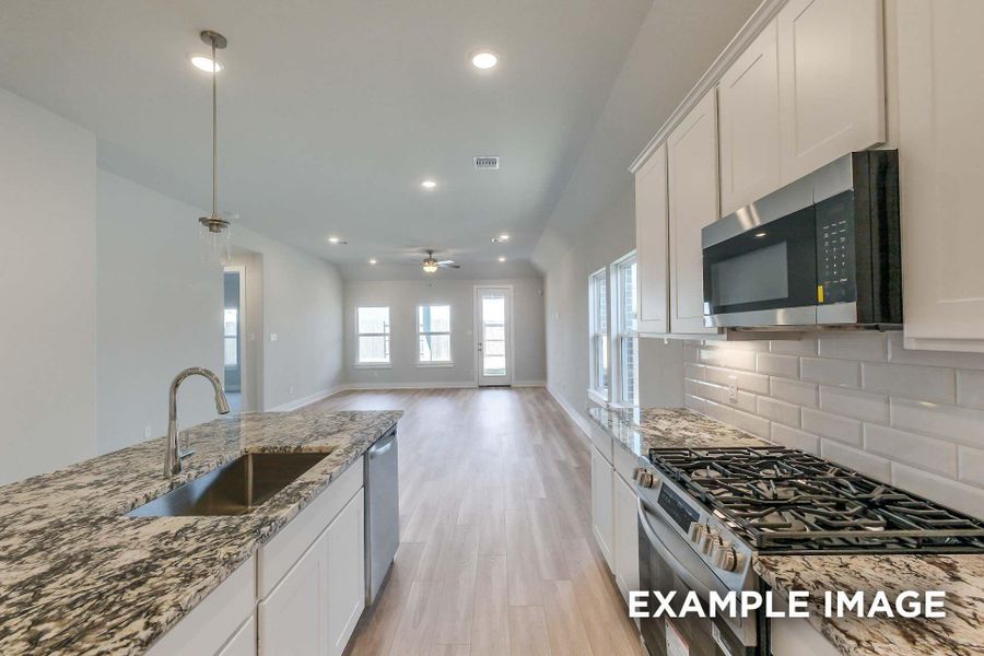 Furnished interior view inside a new home in Sunterra, Katy (Image 4).