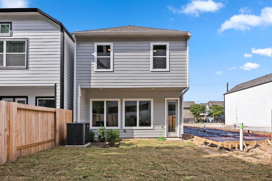 Welcome to your own peaceful backyard retreat, fully fenced for privacy—a rarity and a luxury in Houston's urban landscape.