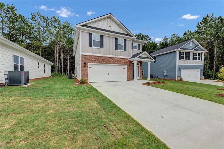 Front exterior of a new home in Canterbury Villas, Carrollton, GA, highlighting curb appeal (Image 20).