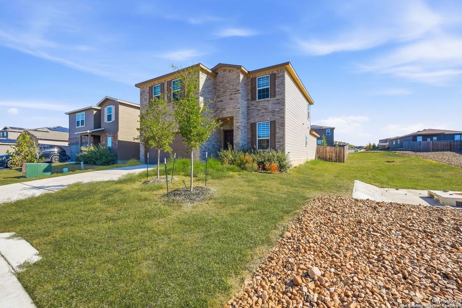 Front exterior of a new home in Cinco Lakes, San Antonio, TX, highlighting curb appeal (Image 1). Front exterior of a new home in Cinco Lakes, San Antonio, TX, highlighting curb appeal (Image 1).