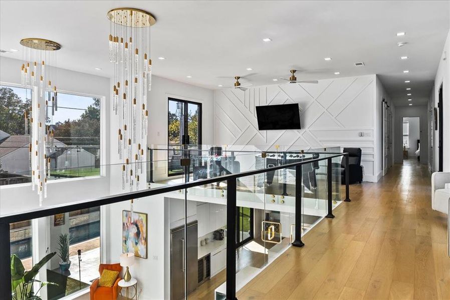 Upper loft area featuring the cascading chandeliers and Great Room below