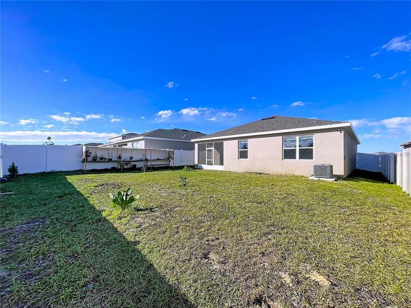 Exterior details and patio area of a home in Covered Bridge at Liberty Bluff, Haines City (Image 32).
