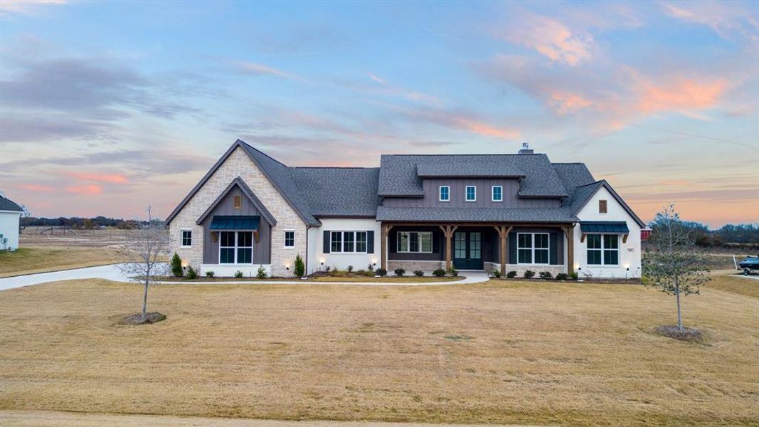 View of front of home featuring a yard