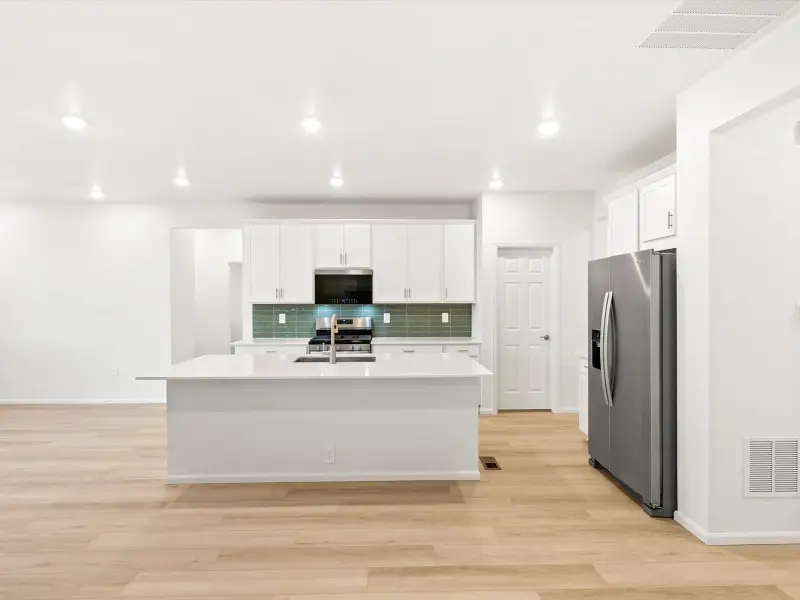 Furnished interior view inside a new home in Paint Brush Hills, Peyton (Image 3).