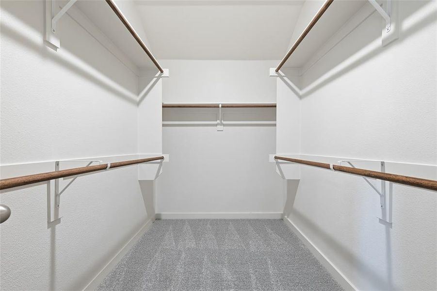 Walk in closet with light carpet Walk in closet with light carpet