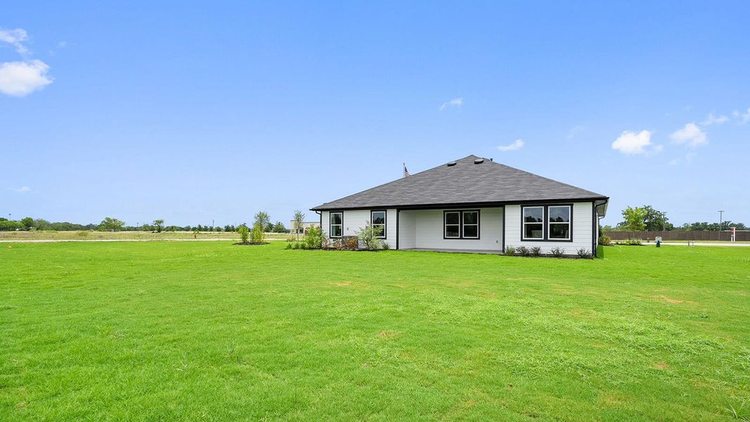 Exterior details and patio area of a home in Railhead, Cedar Creek (Image 3).
