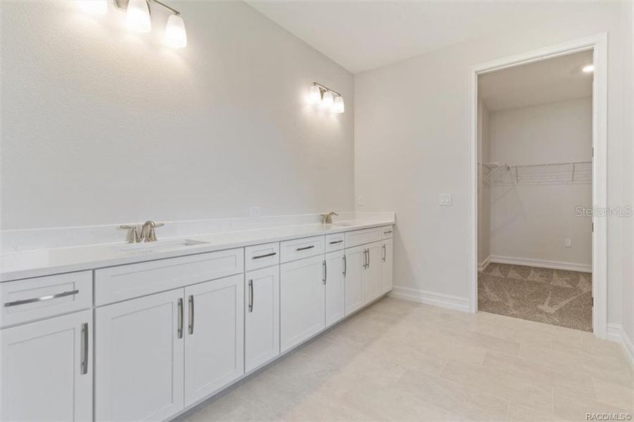 Primary bath with his/ her sinks and plenty of storage