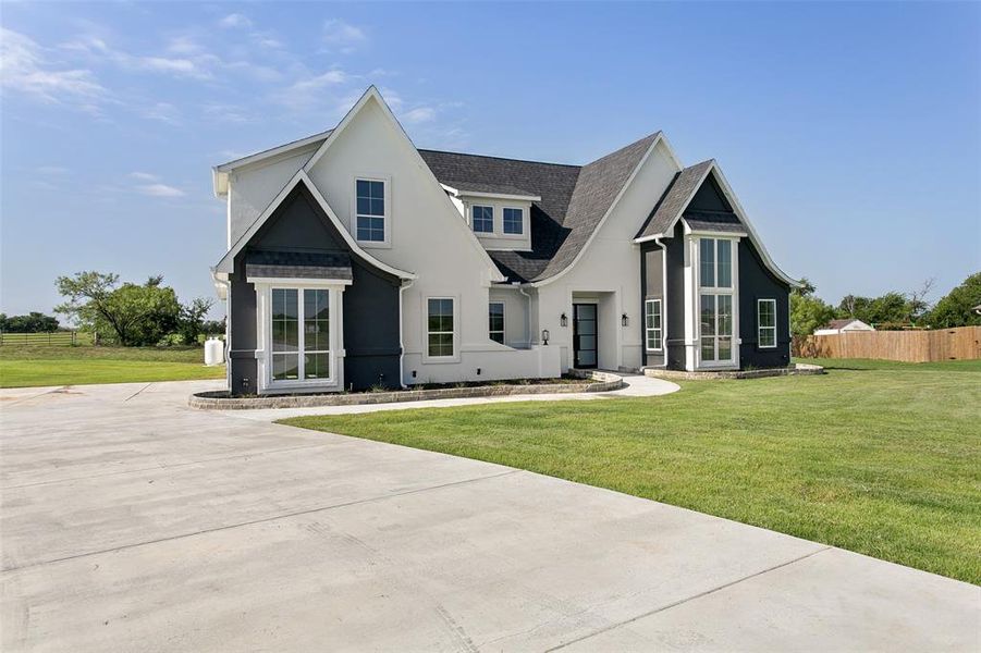 Front exterior of a new home in , Joshua, TX, highlighting curb appeal (Image 2).