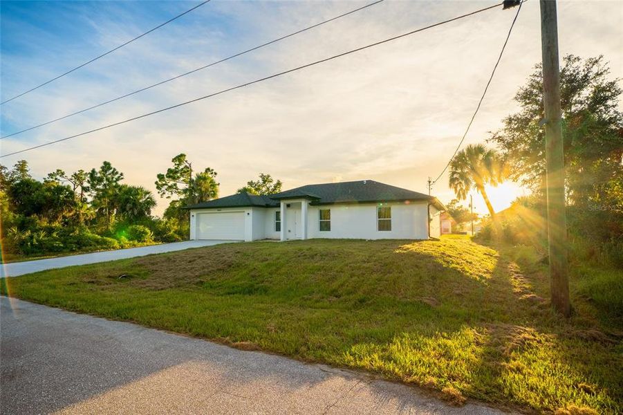 Front exterior of a new home in , Port Charlotte, FL, highlighting curb appeal (Image 2).