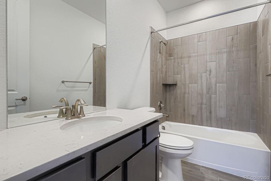 Furnished interior view inside a new home in Macanta: The Grand Collection, Castle Rock (Image 9).